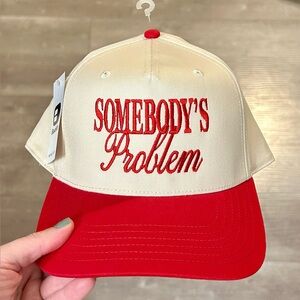 Red and Cream “Somebody’s Problem” Baseball Cap